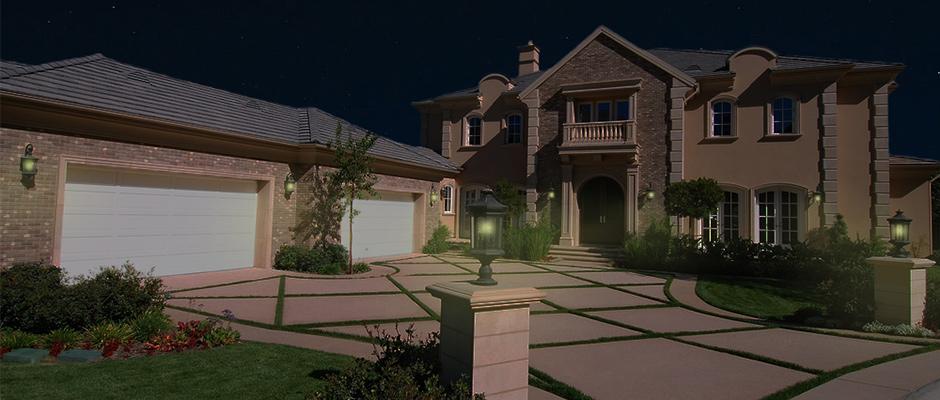 Home in evening time with outdoor motion detector lights on